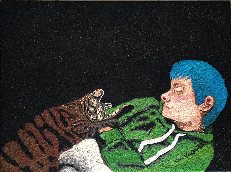 hand embroidered portrait of boy with cat